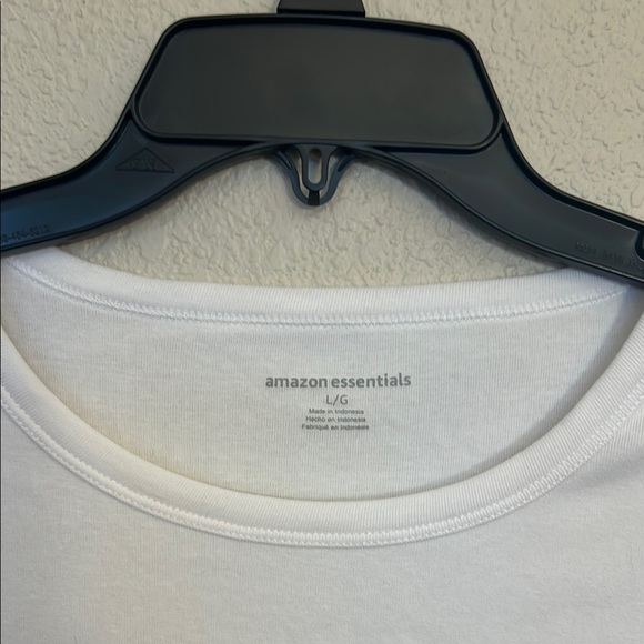 Women large Amazon tops in white and black. One top has a wider neckline. - Picture 9 of 14